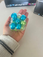Balle squishy anti-stress TDAH à grosses bulles colorées bleues et vertes - fidget sensoriel apaisant pour enfants