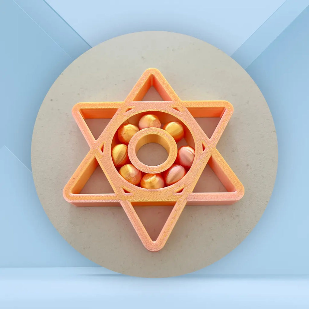 spinner étoile orangé/jaune